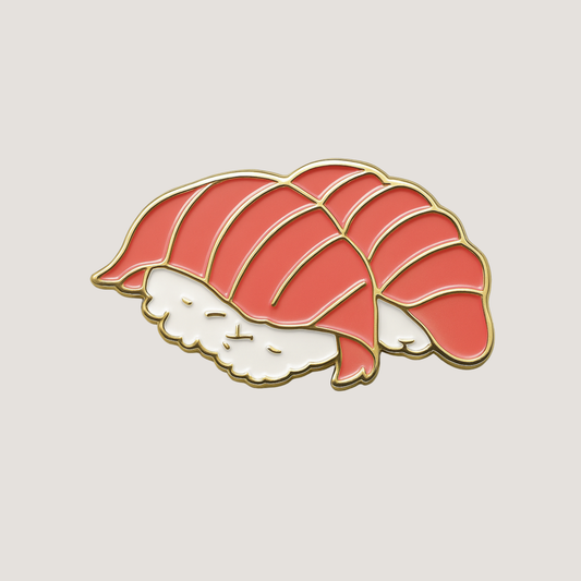 Sushi nigiri roll golf ball marker, with pink sushi topping and shiny raised gold outlines - CHIP PUTTY