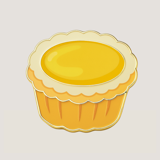 Yellow egg tart with a scalloped edge, and shiny gold raised outlines, shaped golf ball marker - CHIP PUTTY