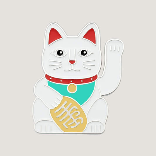 White with silver raised outlines of a Maneki-neko cat golf ball marker with raised paw with red, green and gold details – CHIP PUTTY GOLF